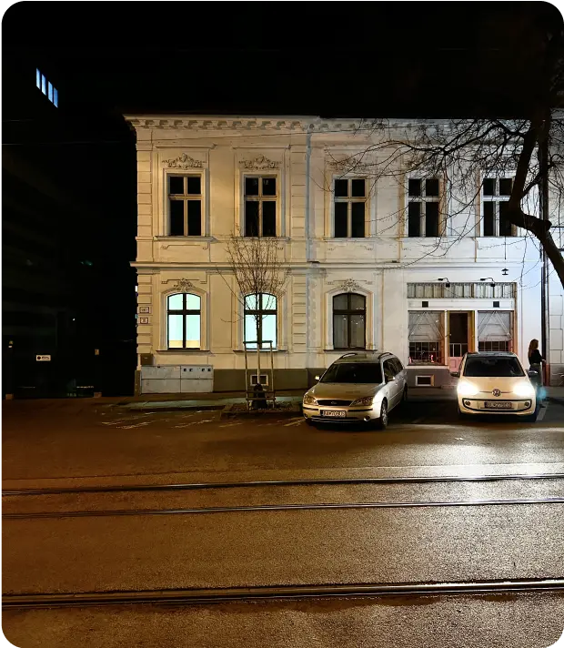 A building on a street at night
