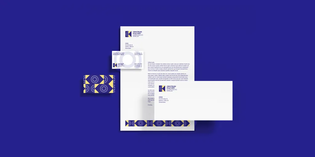 CKKK letterhead, envelope and business cards on dark blue