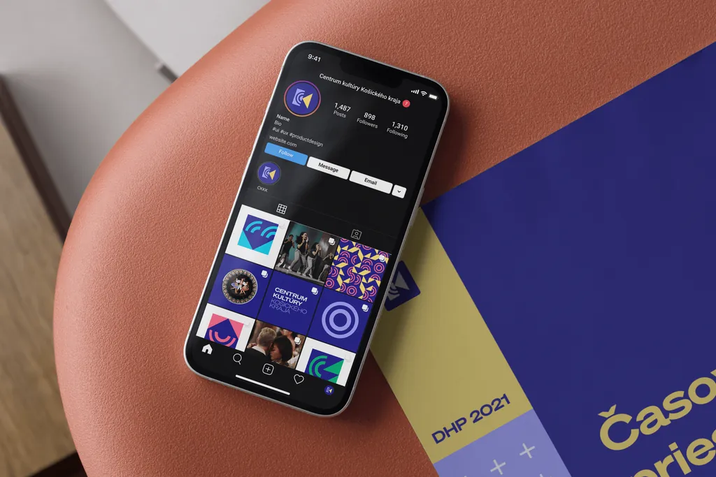 The CKKK Instagram profile on a phone, next to a printed programme
